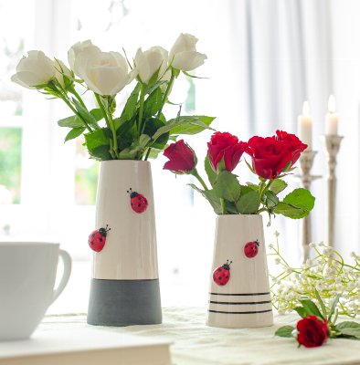 Vase with red bees